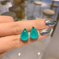 Pear-shaped teal green gemstone stud earrings with silver metal setting on ear - Paraiba Blue Pear Stud Earrings Only (Without Necklace)