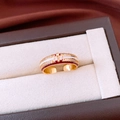 Detail of 18k gold plated ring with fleur-de-lis pattern and red enamel inlay - Red Enamel Fleur-de-lis Style