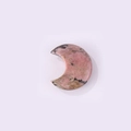 Pink natural stone moon pendant with unique black and brown marbled texture - Rhodonite