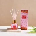 Watermelon scented essential oil reed diffuser in clear glass bottle with pink packaging - Watermelon