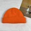 Classic knitted orange docker cap for women featuring ribbed texture and winter warmth - One Size / Orange