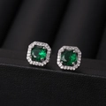 Elegant square halo stud earrings with deep green gemstones in polished silver finish - Emerald