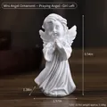 Miniature white resin praying angel statue with matte finish on wooden surface - Mini Praying Angel Left