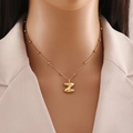 Polished gold bubble letter Z pendant necklace on a delicate beaded chain for women - Letter Z