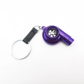 Purple turbocharger keychain made of alloy with spinning blades and black strap detail - Purple