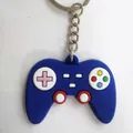 Blue silicone game controller keychain with colorful buttons and silver metal ring - Blue Pink Cross