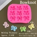 Pink silicone bow mold dimensions 7.5x6x1.2cm with 9 cavities for cake decoration - Bow Mold