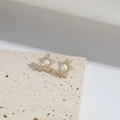 Elegant gold five-pointed star stud earrings with white cubic zirconia on stone base - Pentagram