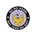 Detail of round enamel brooch featuring a yellow cat and 'Do No Harm But Take No Shit' motto - Mysterious Cat Style (XZ8729)