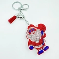 Detail of Santa Claus keychain with red and white rhinestones, silver bell and tassel - Santa Claus