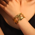 Elegant wide hammered gold cuff bracelet with hollow circular design for women - Geometric Hollow