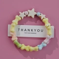 Colorful macaron ceramic bone and star beaded bracelet on a pink display card - 1586-03 Bone Star