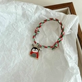 Detail of adjustable Christmas braided bracelet featuring a cute penguin charm and bells - Christmas Antler Penguin