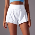 Detailed view of high-waist white athletic skort featuring pleated hem and moisture-wicking fabric - S / White