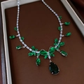 Silver necklace featuring green emerald-cut stones and a butterfly pendant with teardrop drop - Necklace-Green-Butterfly Water Drop