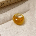 Macro shot of thick amber resin ring with sand texture on beige canvas background - 37# Ring - Amber - Transparent Resin