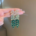 Detailed close-up of leaf-shaped marquise-cut crystal earrings with long tassels - Green Leaf Tassel (HE11296)