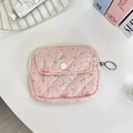 Macro shot of pink floral rabbit pattern quilted storage pouch with white snap button - Bouquet Rabbit