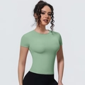 Detailed close-up of slim-fit light green yoga t-shirt with breathable performance fabric - S / Top (7131 Short Sleeve) / Grey Mint