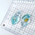 Luminous blue shell-shaped resin charm with natural seashell inside for DIY crafts - Lake Blue