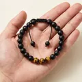 Detailed close-up of 8mm beaded bracelet featuring matte black and tiger eye stones - Matte Black Tiger Eye Braided