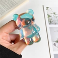 Macro detail of iridescent laser bear phone grip with glowing rainbow finish - Bear Airbag Stand / Blue Light Bear