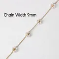 Detailed view of 9mm golden chain with white pearl flower accents and beaded centers - Gold + Pearl Flower