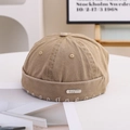 Detail of khaki cotton miki hat featuring a superior metal plate and frayed edge texture - 55-58cm / Metal Label Style / Khaki