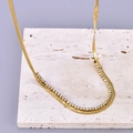 Collar de doble capa en acero dorado con circón y patrón de hueso de serpiente - Oro de 18K