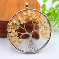 Silver tree of life pendant handmade with yellow crystal stones on white background - Silver Scattered Root Citrine