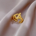 Detailed close-up of gold chain-link ring with micro-pave T-bar toggle on pink satin - Adjustable Open / Gold (J0061 Real Gold Plated)
