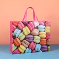 Large waterproof macaron print shopping bag with pink handles and secure snap button - Macarons