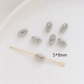 Macro detail of 5x8mm hollow silver beads and gold T-pin jewelry making components - 5*8mm / White Gold
