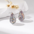 Macro detail of silver teardrop earrings featuring multi-colored micro-paved zircons - Colorful