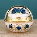 Spherical white ashtray with blue roses and gold trim on a wooden tabletop - Gold White Blue Rose