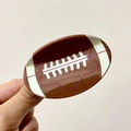 Rugged brown American football hair claw clip with realistic white stitching texture - Small Brown Football (6.8cm)