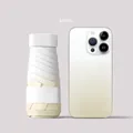 Mini khaki portable UV sun umbrella shown next to a smartphone for size reference - Gradient Beige
