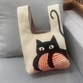 Off-white knit tote bag featuring a cute black cat and yarn ball pattern with wide handles - Beige Cat
