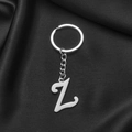 Polished silver stainless steel keychain featuring initial Z on black silk fabric - Letter Z