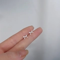 Elegant 925 sterling silver bow knot stud earrings with polished metallic finish - Bowknot / Silver