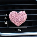 Detail view of pink rhinestone heart vent clip with dimensions 3cm by 2.6cm on car grille - Pink Heart