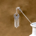 Silver flower hairpin with turquoise tassels placed in a white ceramic vase - Silver/F384/Pattern Tassel