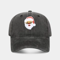Close-up of a black washed cotton baseball cap with embroidered cartoon Santa Claus patch - Adjustable / Santa Claus Pattern Black