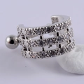 Macro detail of silver stainless steel cartilage stud earring with triple row zirconia - Style 13# Silver