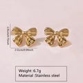 Macro view of golden bow earrings in stainless steel with exact weight and size info - Stainless Steel Bow Smooth Studs