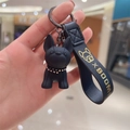 Detail of matte black French Bulldog keychain with diamond collar and leather strap - Black