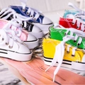 Miniature colorful canvas sneaker keychains in various vibrant shades with metal rings - Multicolor