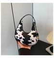 Detail of trendy cow print PU leather crescent bag with golden metal hardware zipper - Cow Print