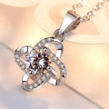 Macro detail of silver clover pendant necklace featuring a round-cut stone and pavé setting - Xl-17 [with Cross Chain]