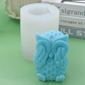 Face-covering owl silicone mold with sky blue owl candle showing detailed feather texture - Covering Eyes - Owl